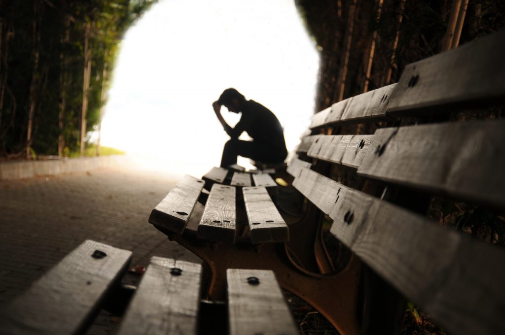 This is an image for a man sitting and pondering